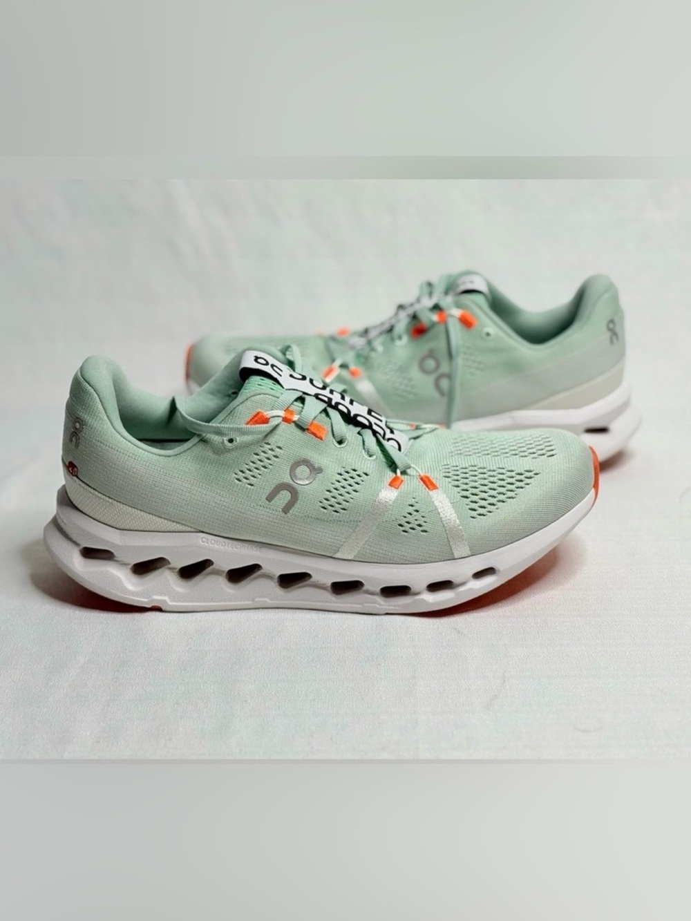 On Running Women's Mint Green Athletic Sneakers with Orange Accents